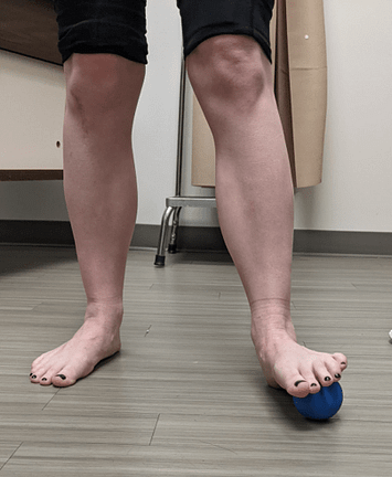 lateral foot mobilization Standing on the ball placed at this location, the runner gently rotates their upper body side to side.